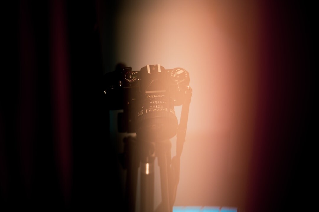 Vintage television studio camera pointed at a stage
